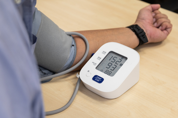 patient taking blood pressure test